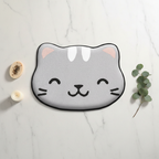 Flat lay tapis de bain chat