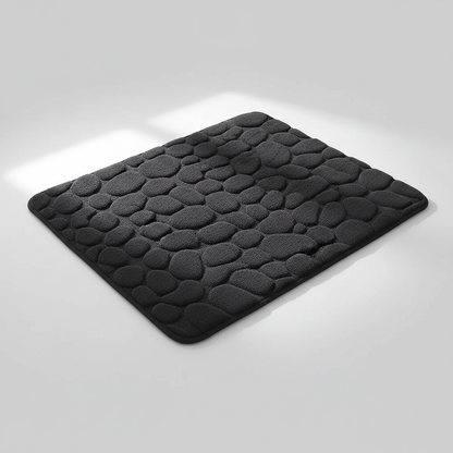 Tapis de bain noir galets sur fond gris clair avec ombre élégante
