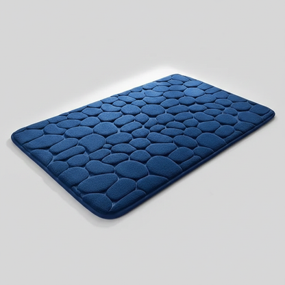 Tapis de bain bleu marine galets sur fond gris clair avec ombre élégante